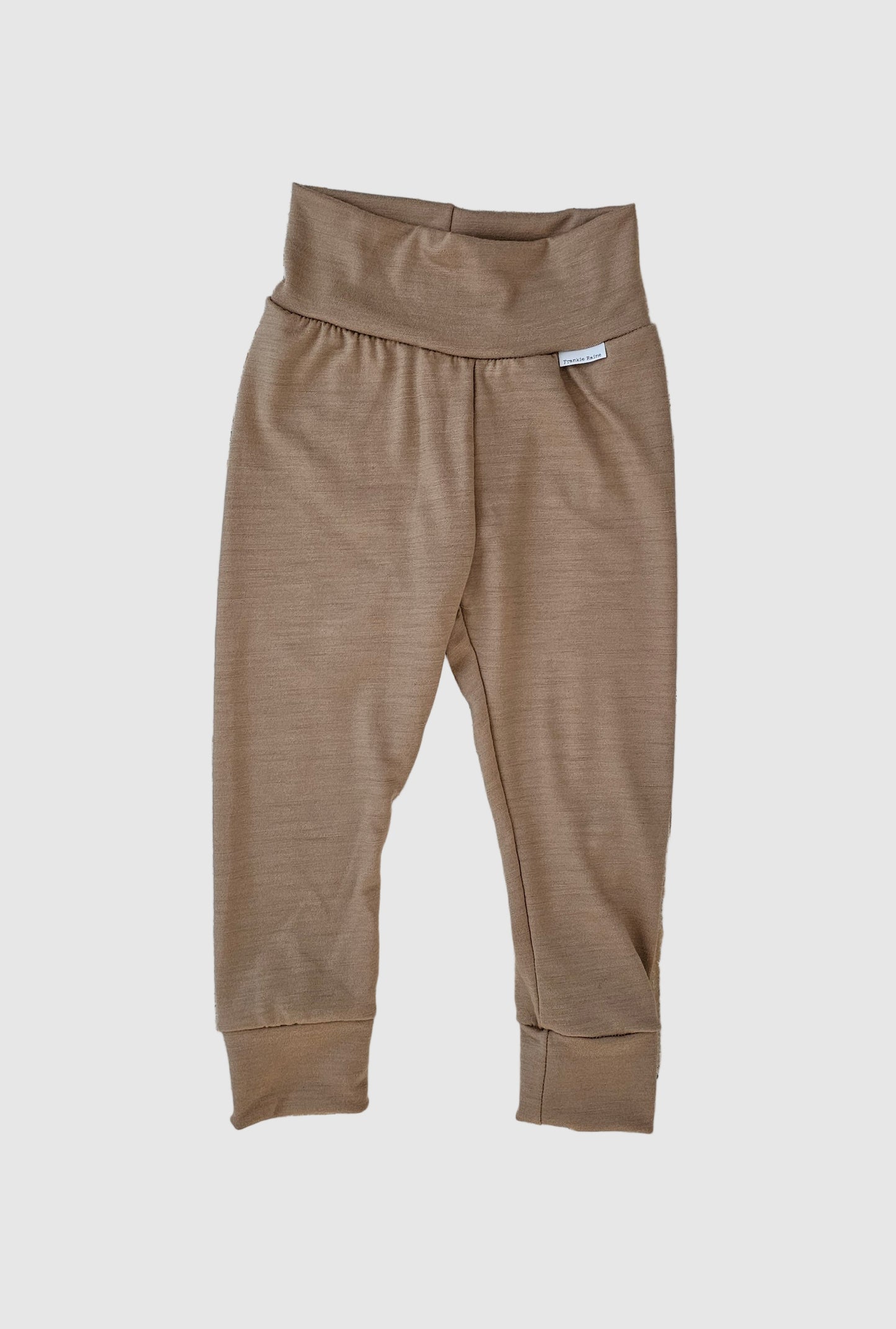 Brown pants on a wooden surface