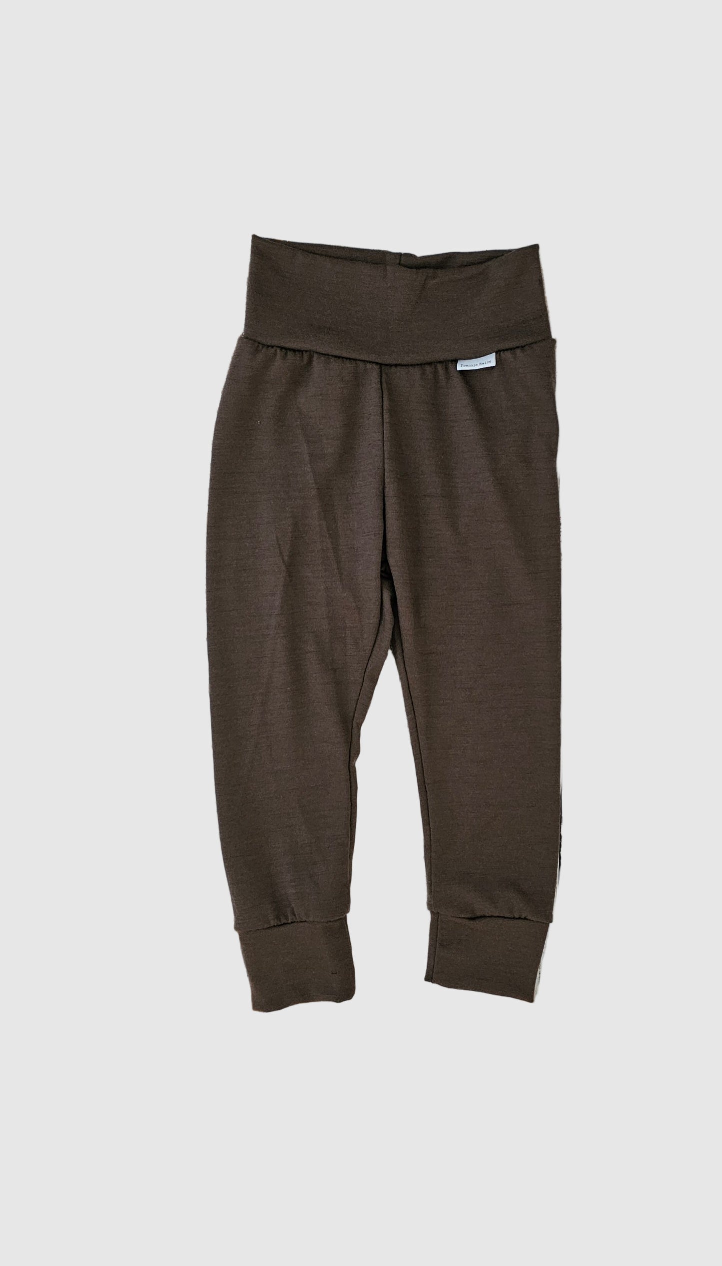 Brown pants on a wooden surface