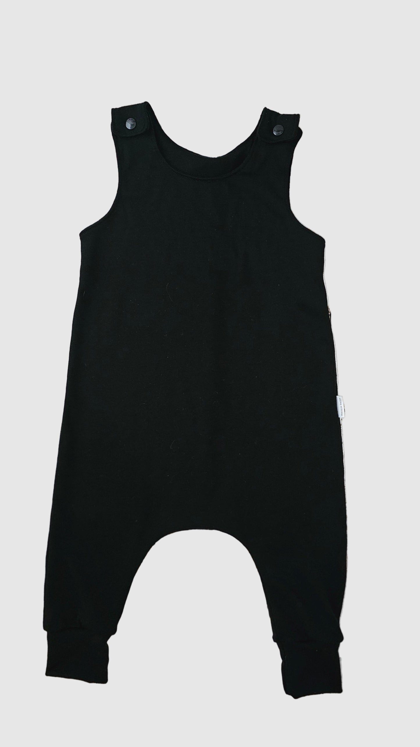 Black overalls on a wooden background