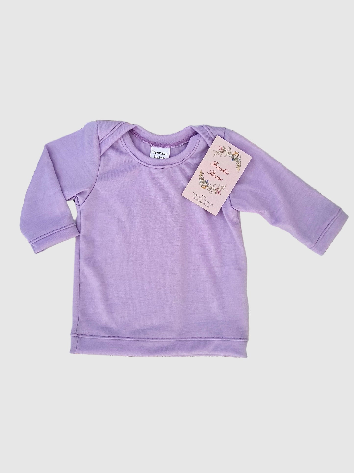 Flat lay purple baby long sleeve tee