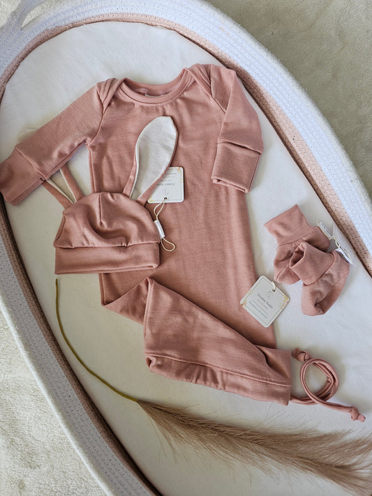 Vintage Blush merino baby gift set styled flat lay in a change basket.
