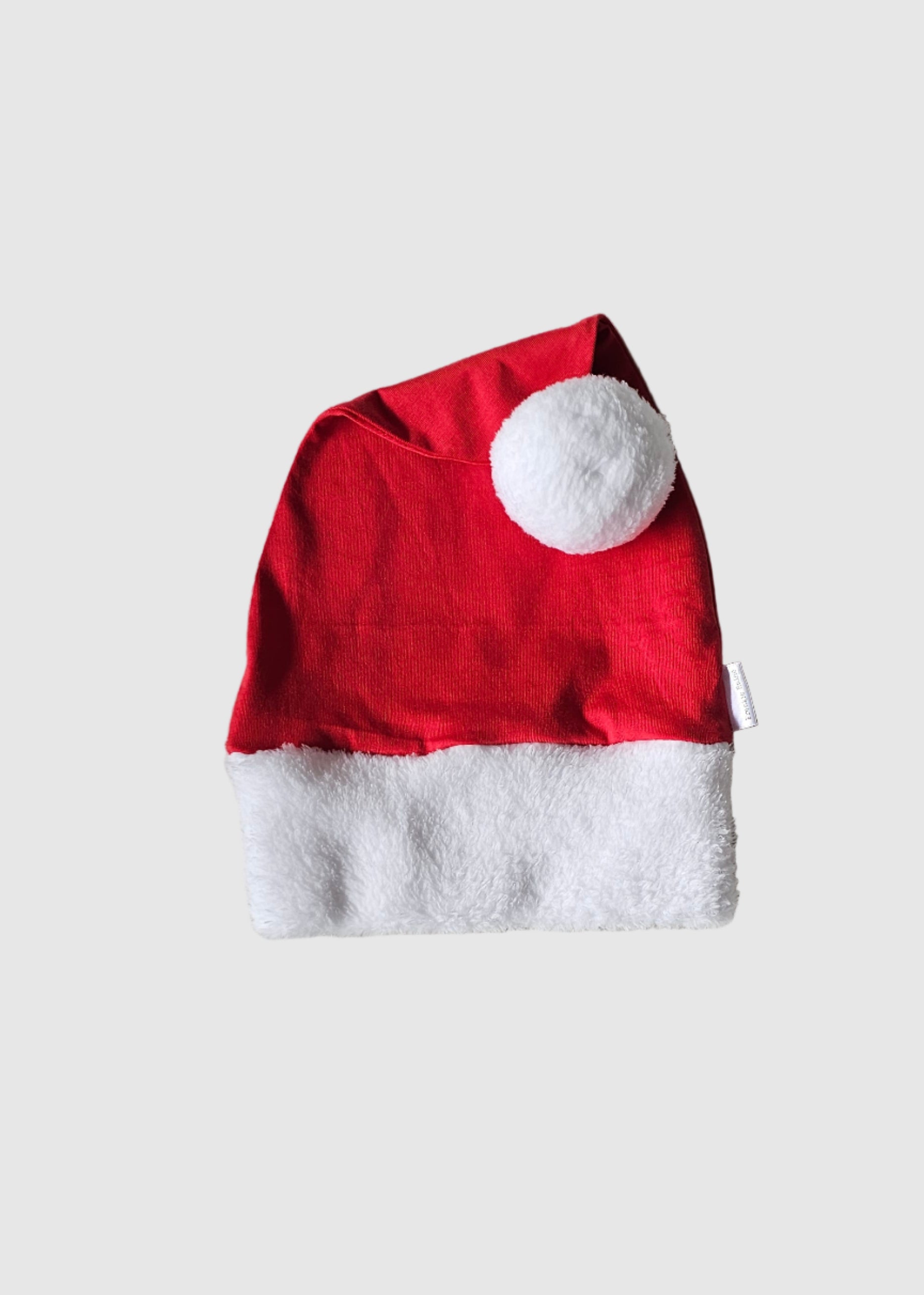 Red and white fabric on a textured gray surface