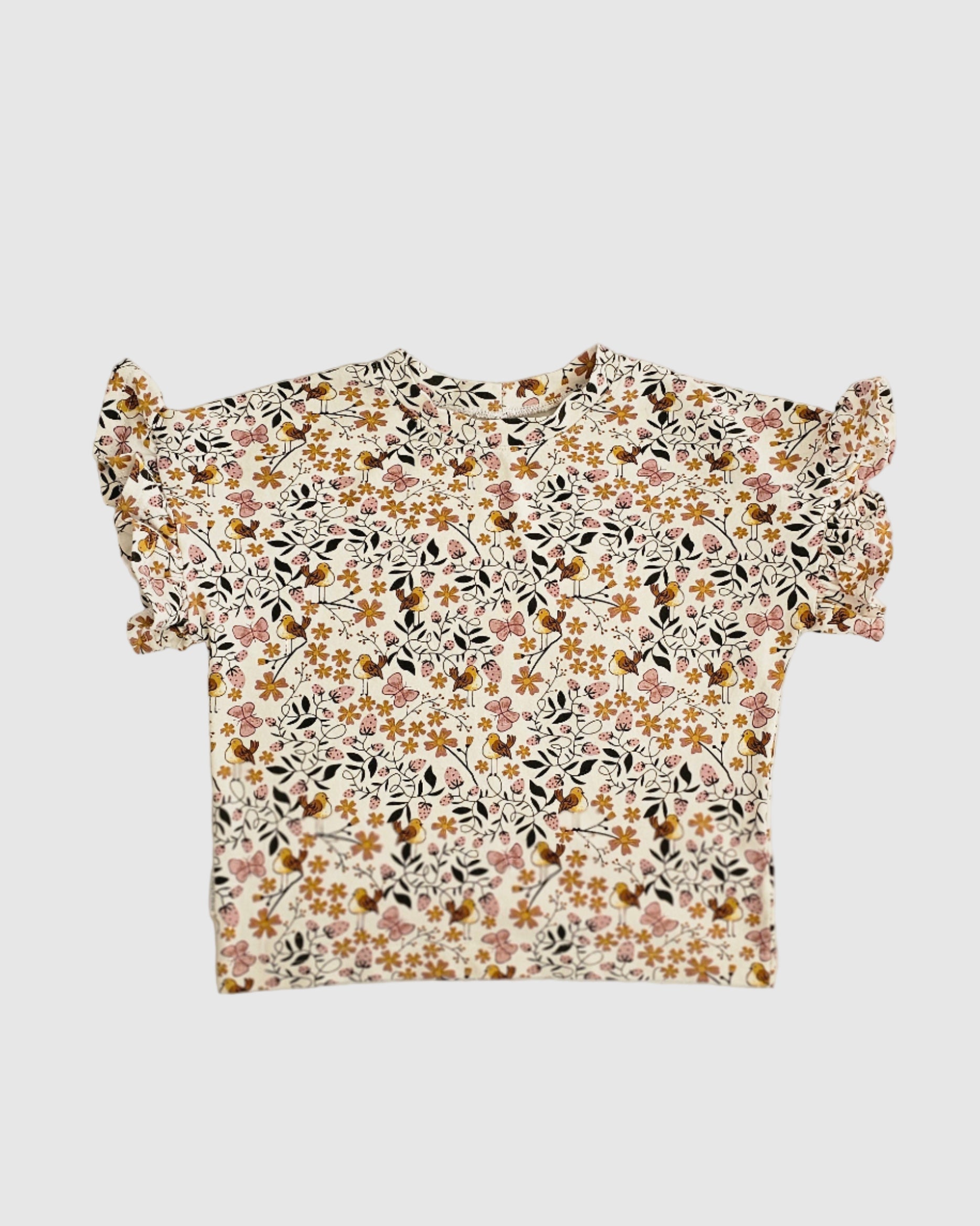 Floral patterned top on a white background
