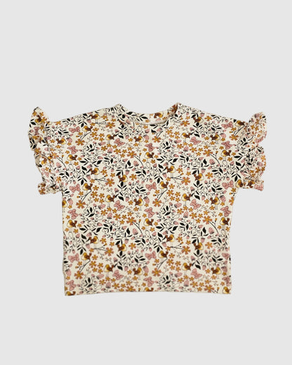 Floral patterned top on a white background